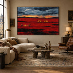 Prairie Embers western landscape painting with golden horses and crimson fields above a cream sofa in a warm living room