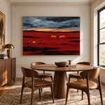 Prairie Embers dramatic prairie painting displayed over a round wood dining table in a bright dining room
